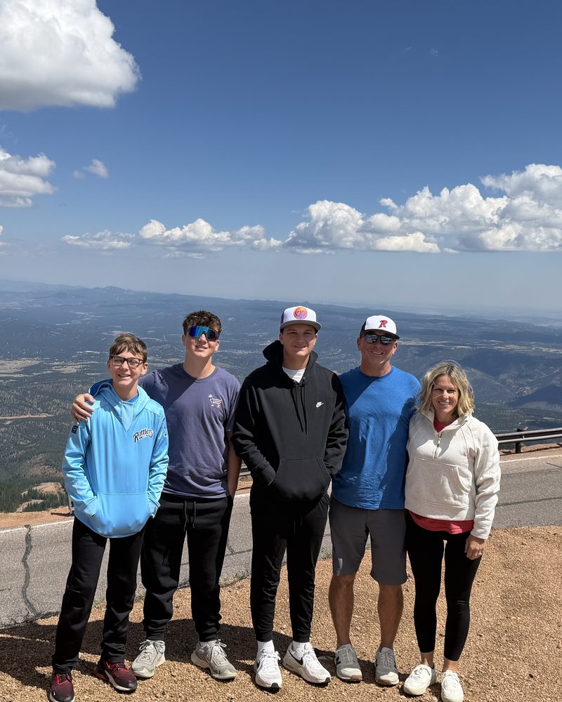 Jim with his family at a mountain overlook